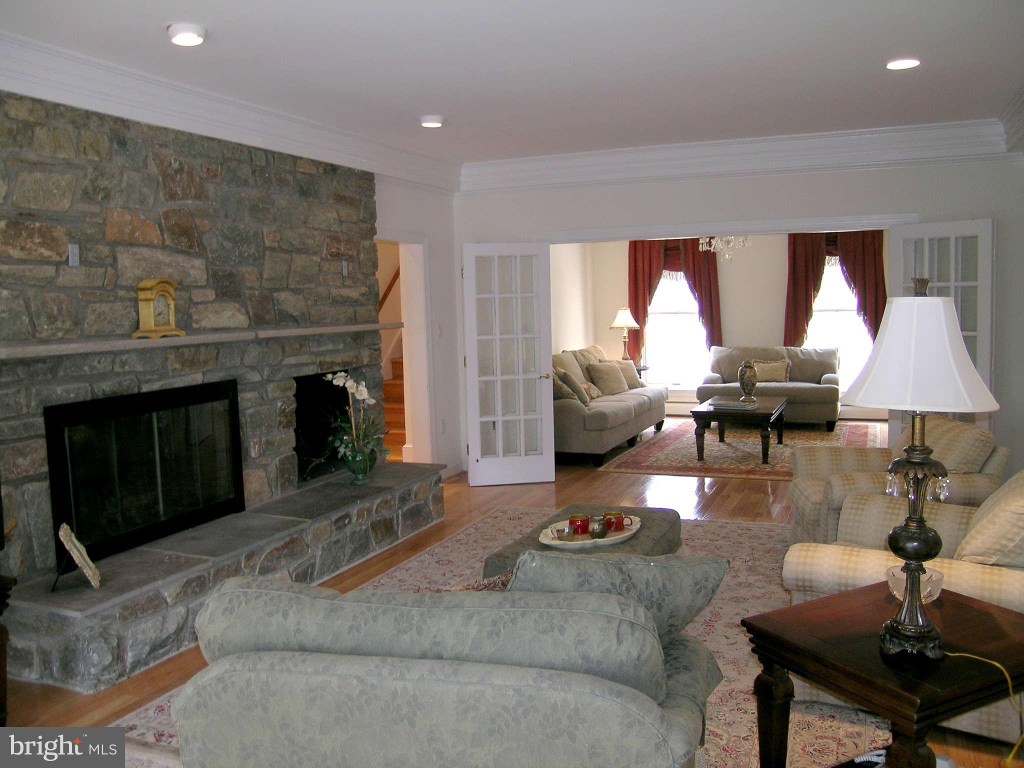 7570 Potomac Fall Road McLean, VA 22102 - Photo 3 of 20 a living room with furniture and a fireplace