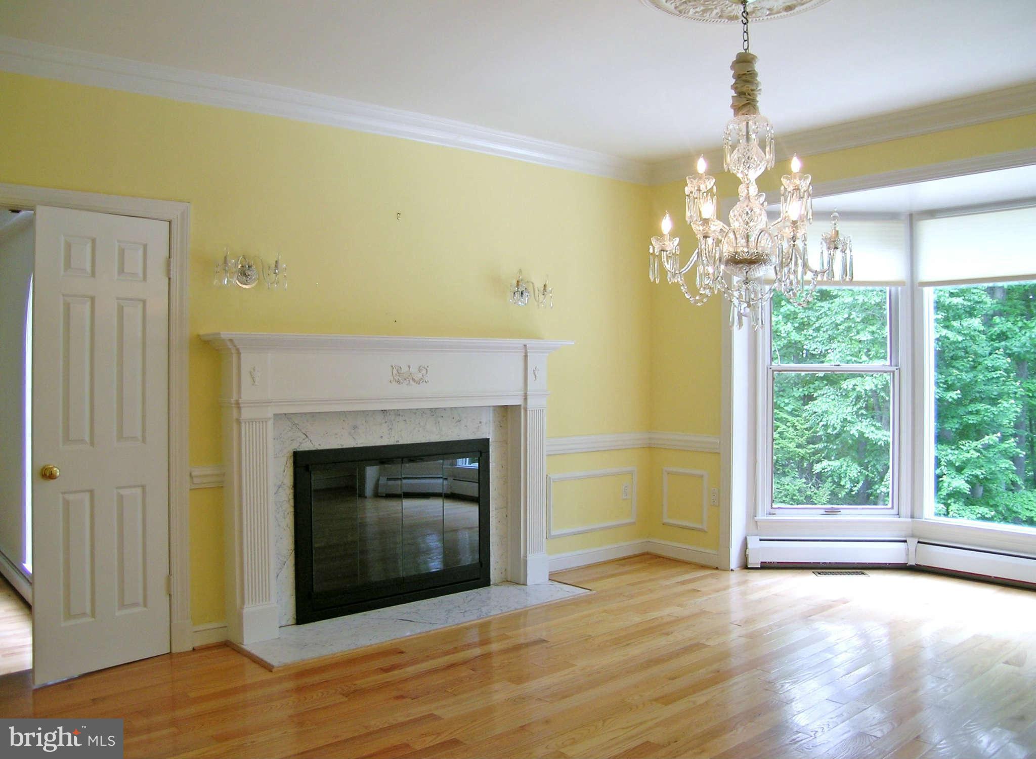 7570 Potomac Fall Road McLean, VA 22102 - Photo 5 of 20 a view of an empty room with a fireplace