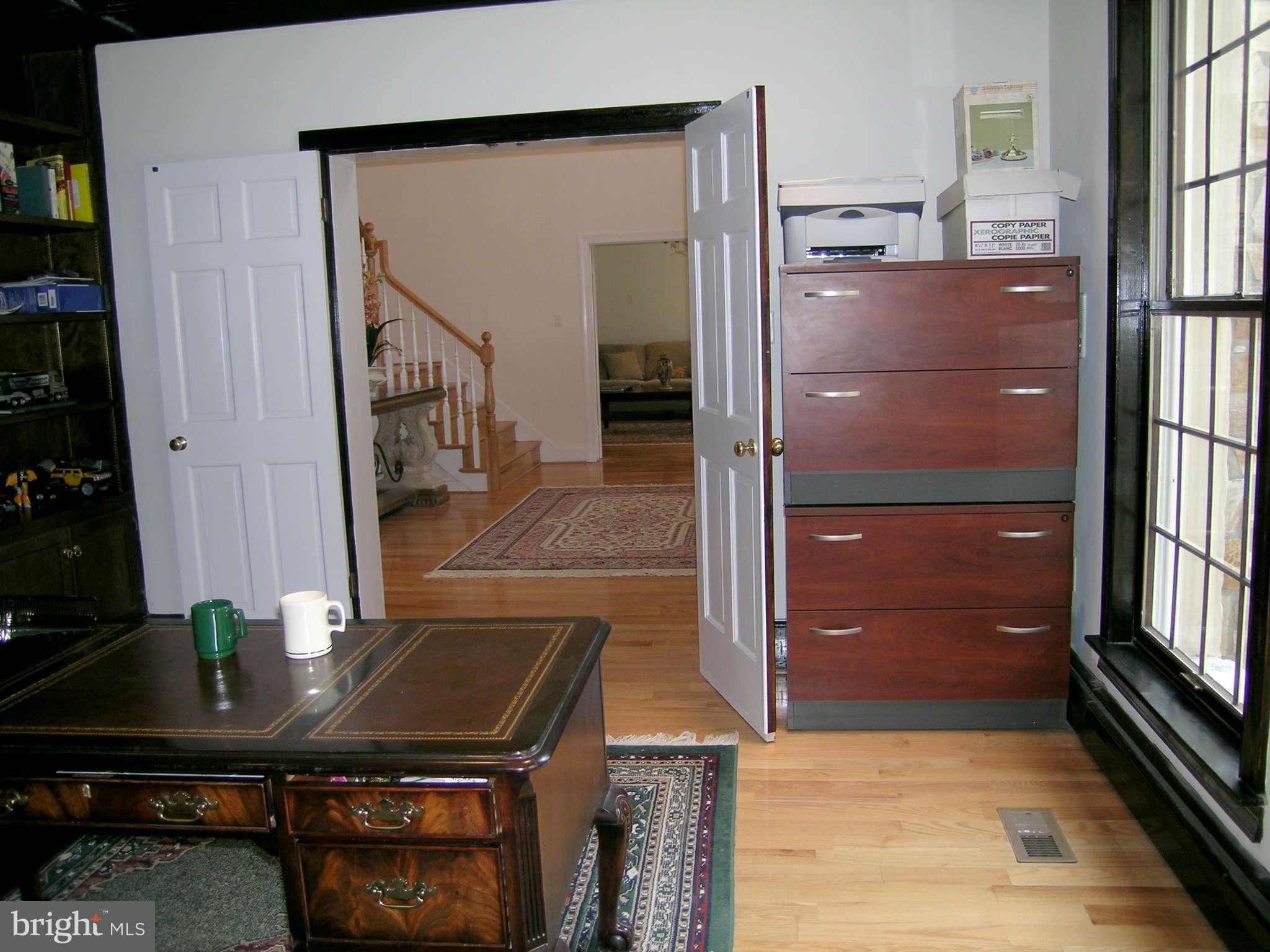 7570 Potomac Fall Road McLean, VA 22102 - Photo 8 of 20 a view of a livingroom with furniture and staircase