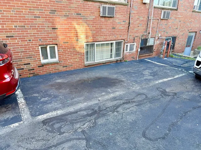 a view of a house with backyard and chairs