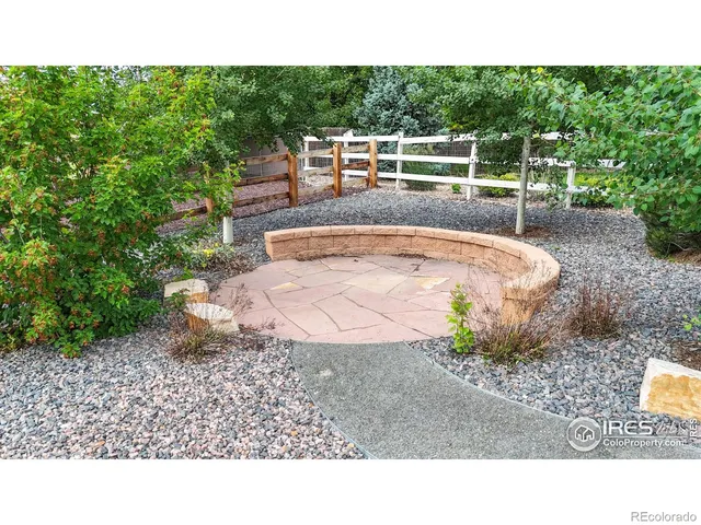 a view of a backyard with sitting area