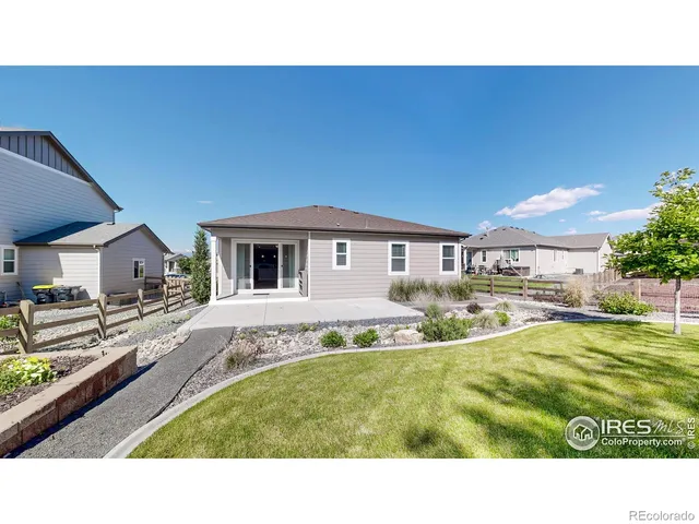 a swimming pool with outdoor seating and yard