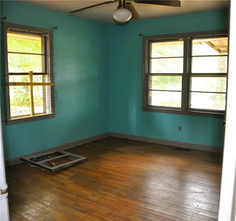 590 Villa Rica Highway Dallas, GA 30157 - Photo 8 of 11 a view of a room with wooden floor and windows