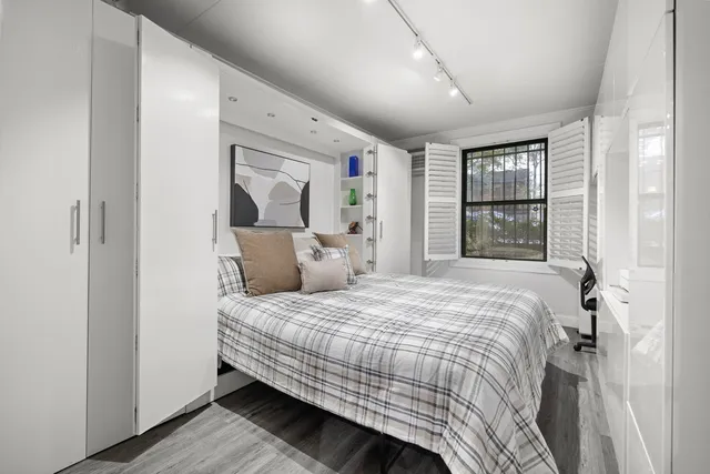 a bedroom with a workspace