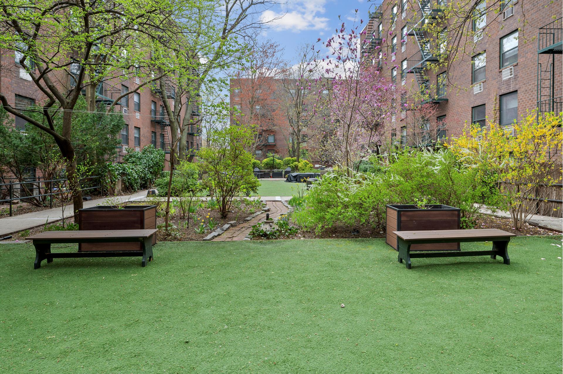 622 Washington Street, Unit GB Manhattan, NY 10014 - Photo 7 of 8 a view of a bench in a garden