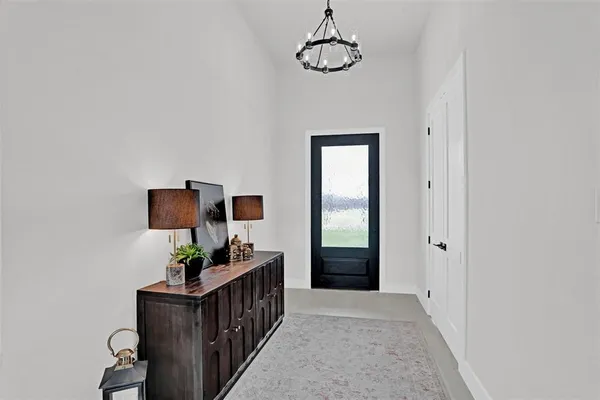 a view of room with window and furniture