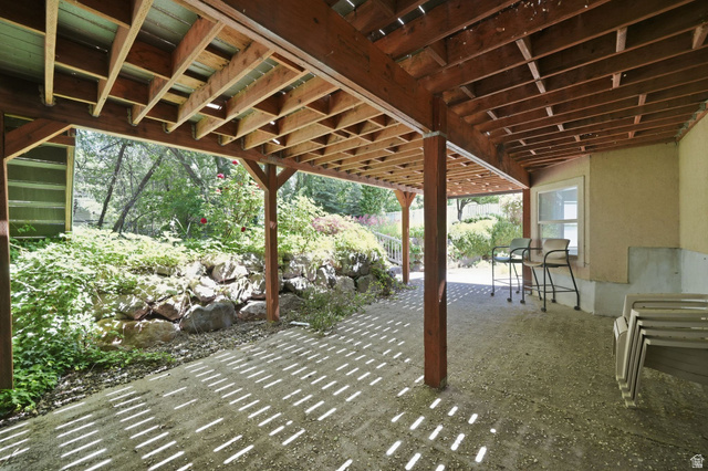883 East 700 South Springville, UT 84663 - Photo 44 of 59 Expansive covered patio area with exposed wood joist ceiling