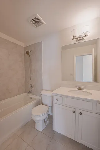 a bathroom with a sink a toilet and a bathtub