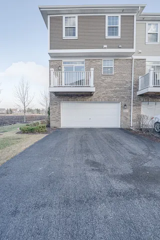 a view of a house with backyard and deck