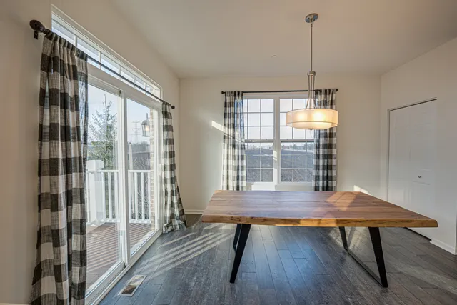 a view of a room with furniture window and wooden floor