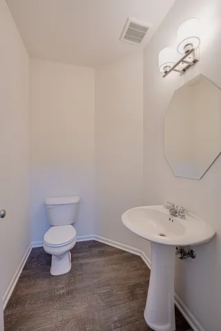a bathroom with a sink and a toilet