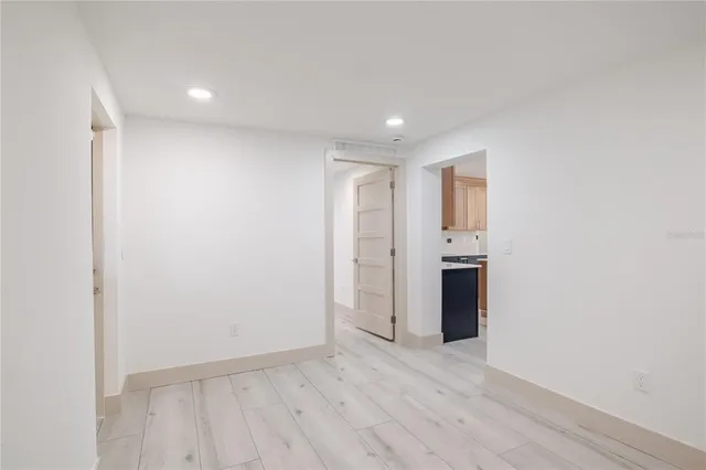 a view of an empty room with a fireplace