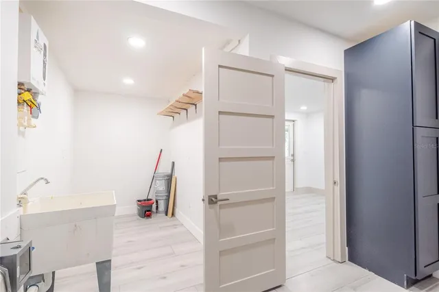 a view of a livingroom with a furniture and staircase