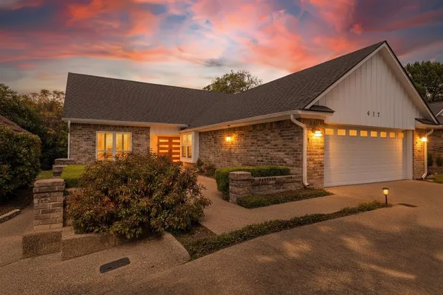 a view of a house with backyard sitting area and garden