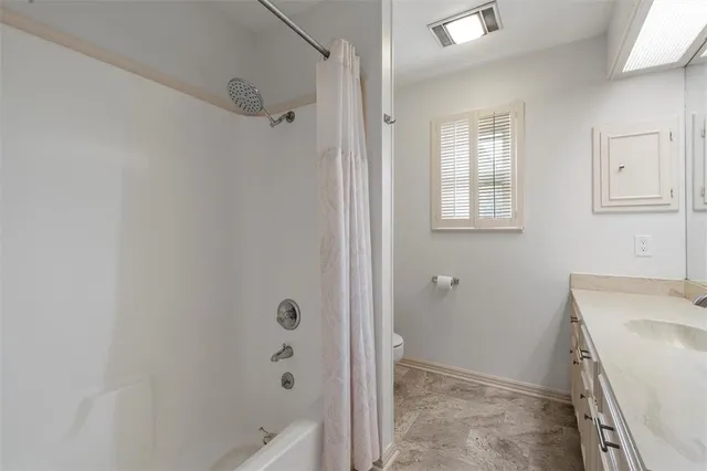 a bathroom with a sink a bath tub and a shower