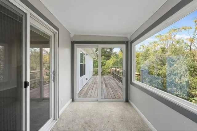 a view of a room with large windows