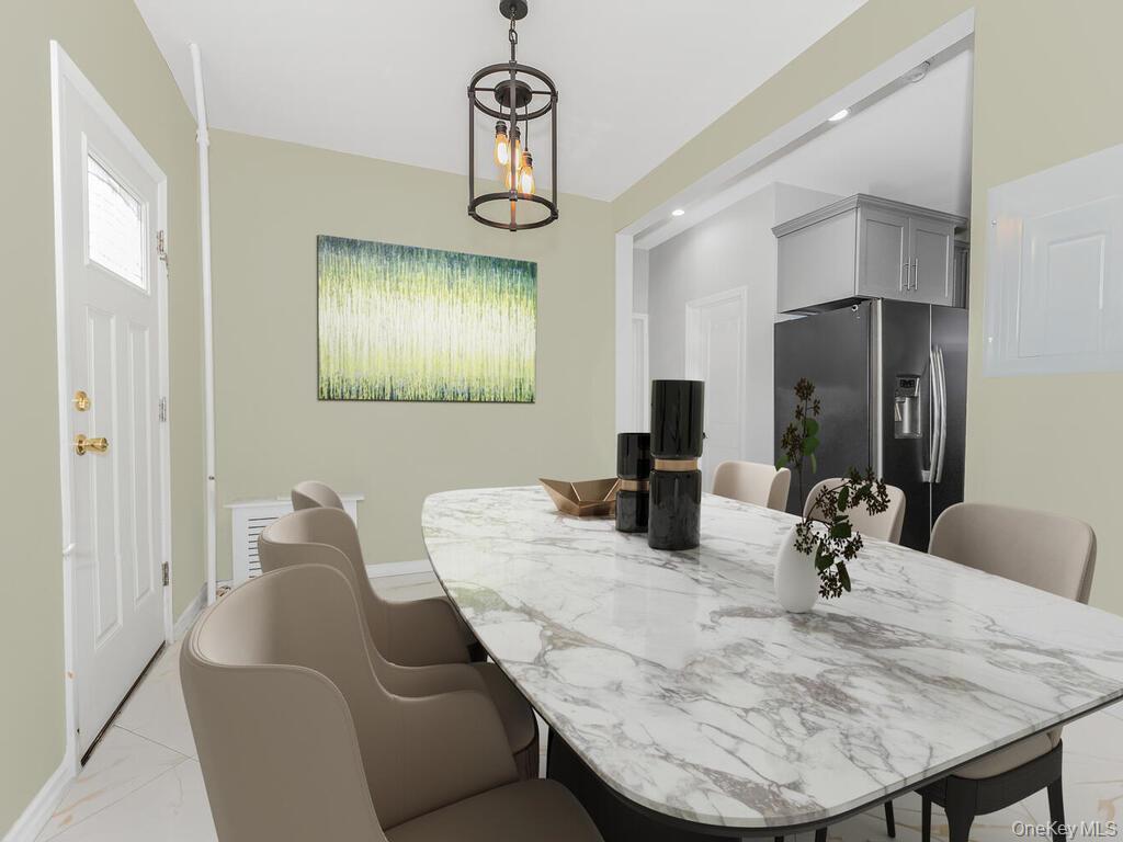 146-84 182nd Street Queens, NY 11413 - Photo 1 of 45 a dining room with furniture and window
