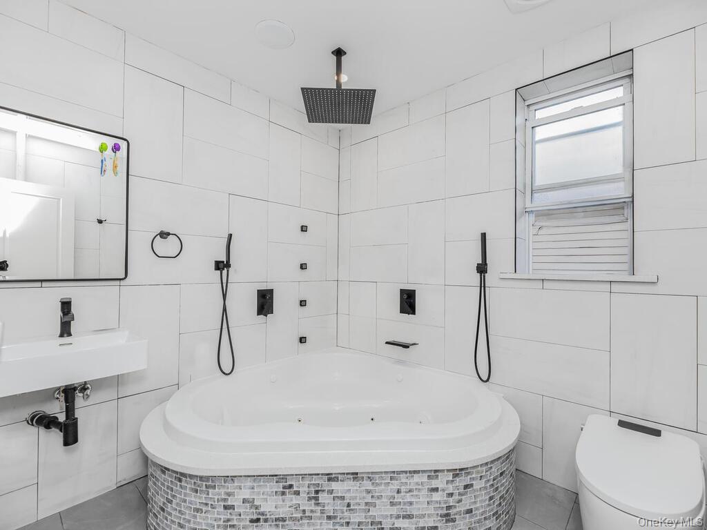 146-84 182nd Street Queens, NY 11413 - Photo 13 of 45 a bathroom with a toilet and a shower