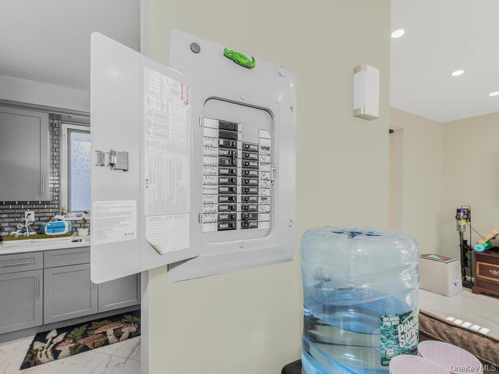 146-84 182nd Street Queens, NY 11413 - Photo 15 of 45 a bathroom with a granite countertop sink a toilet and shower