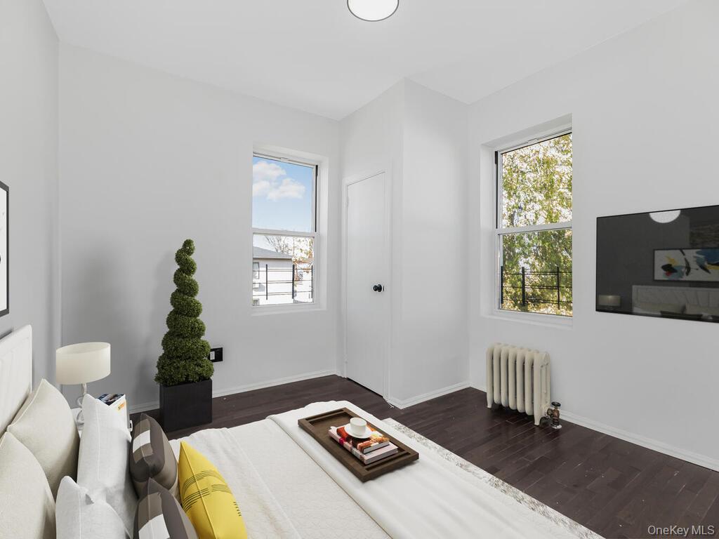 146-84 182nd Street Queens, NY 11413 - Photo 17 of 45 a bedroom with a bed and a window