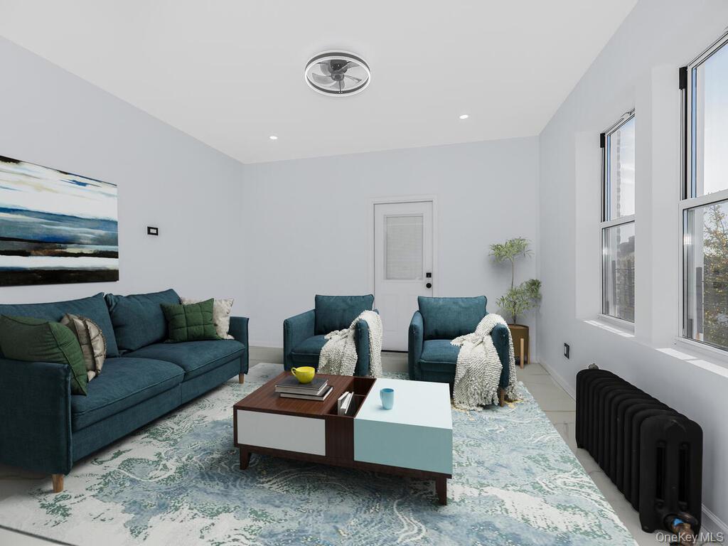 146-84 182nd Street Queens, NY 11413 - Photo 23 of 45 a living room with furniture and a flat screen tv