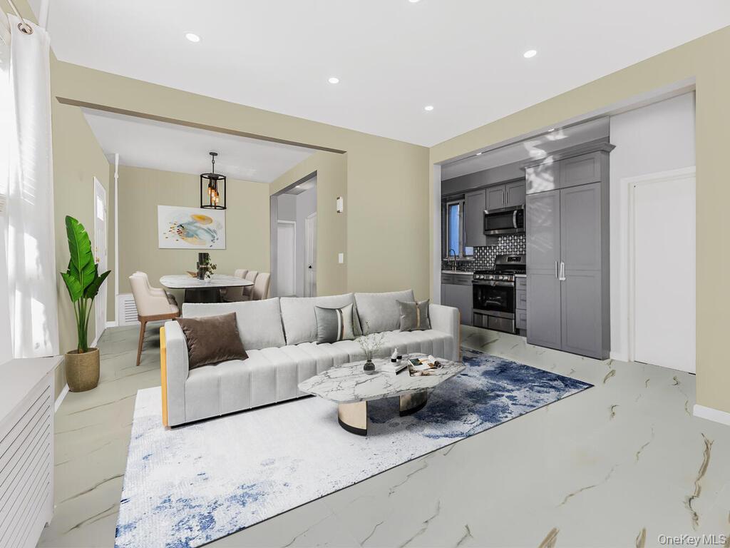 146-84 182nd Street Queens, NY 11413 - Photo 3 of 45 a living room with furniture and a table