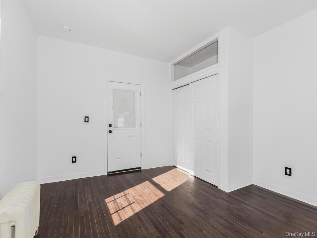 146-84 182nd Street Queens, NY 11413 - Photo 35 of 45 a view of a room with wooden floor