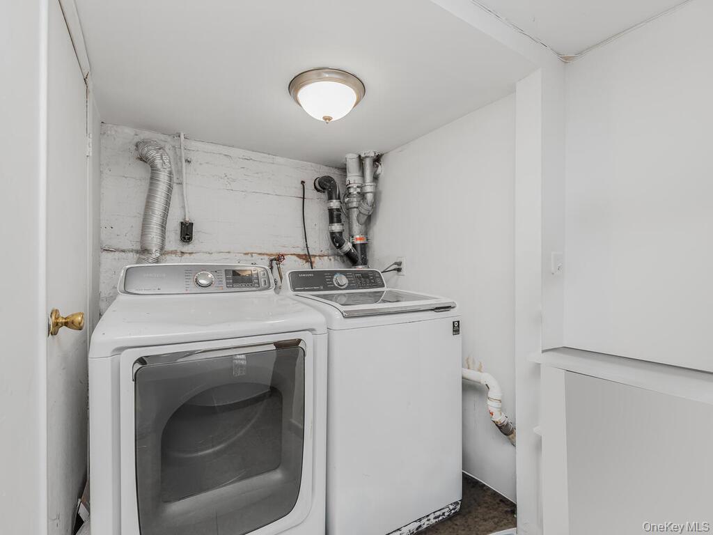 146-84 182nd Street Queens, NY 11413 - Photo 40 of 45 a utility room with dryer and washer