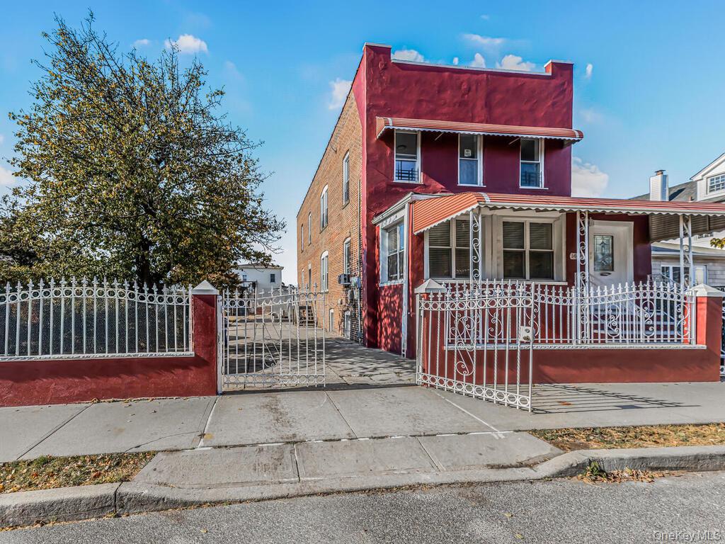 146-84 182nd Street Queens, NY 11413 - Photo 41 of 45 a front view of a house with a fence