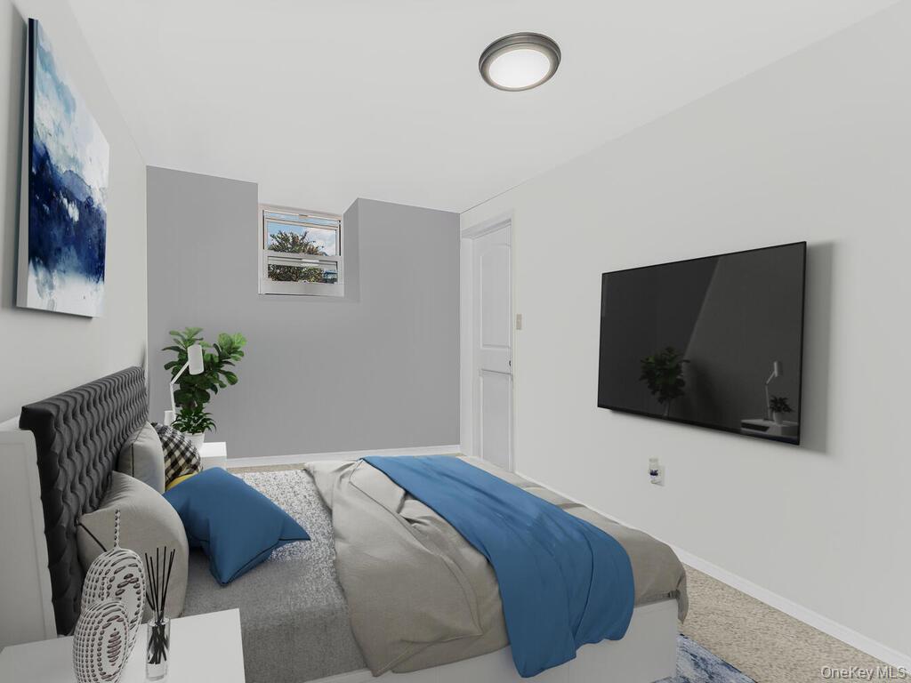 146-84 182nd Street Queens, NY 11413 - Photo 9 of 45 a bedroom with a bed and a flat screen tv