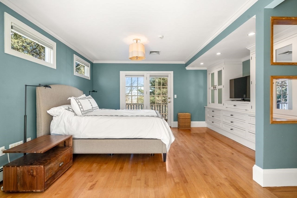 46 Hyslop Road Brookline, MA 02445 - Photo 17 of 33 a spacious bedroom with a bed and wooden floor
