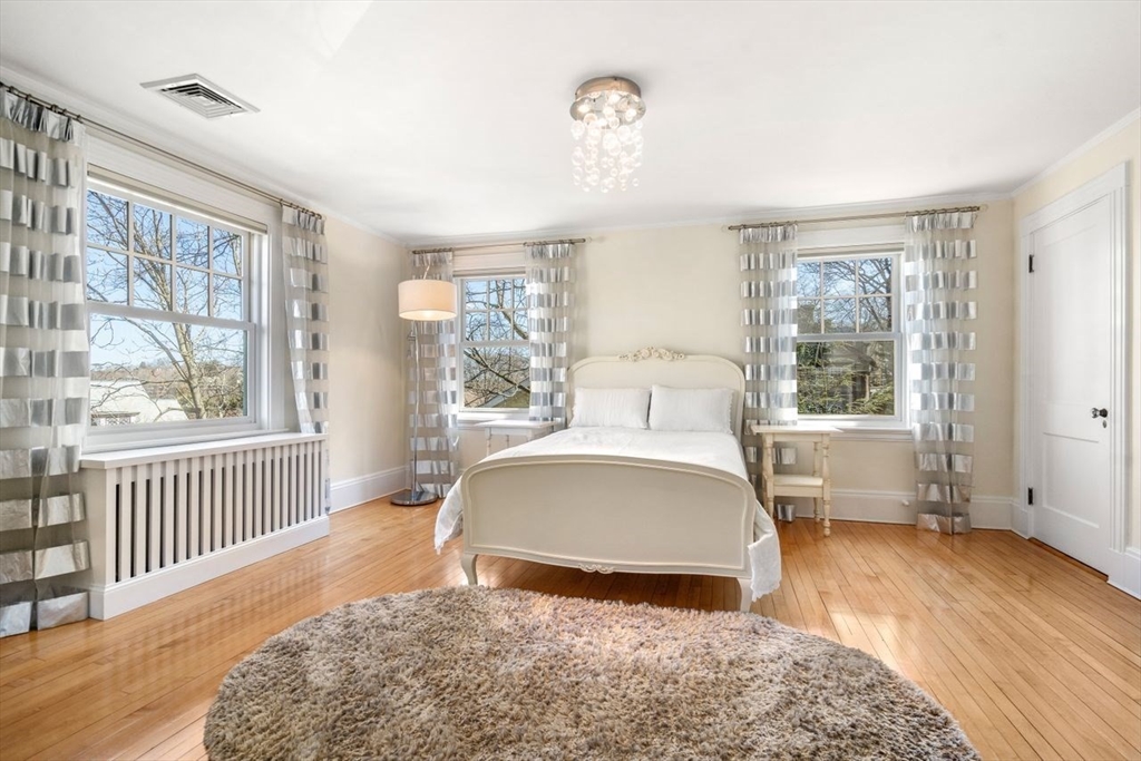 46 Hyslop Road Brookline, MA 02445 - Photo 20 of 33 a bedroom with a large bed and a window