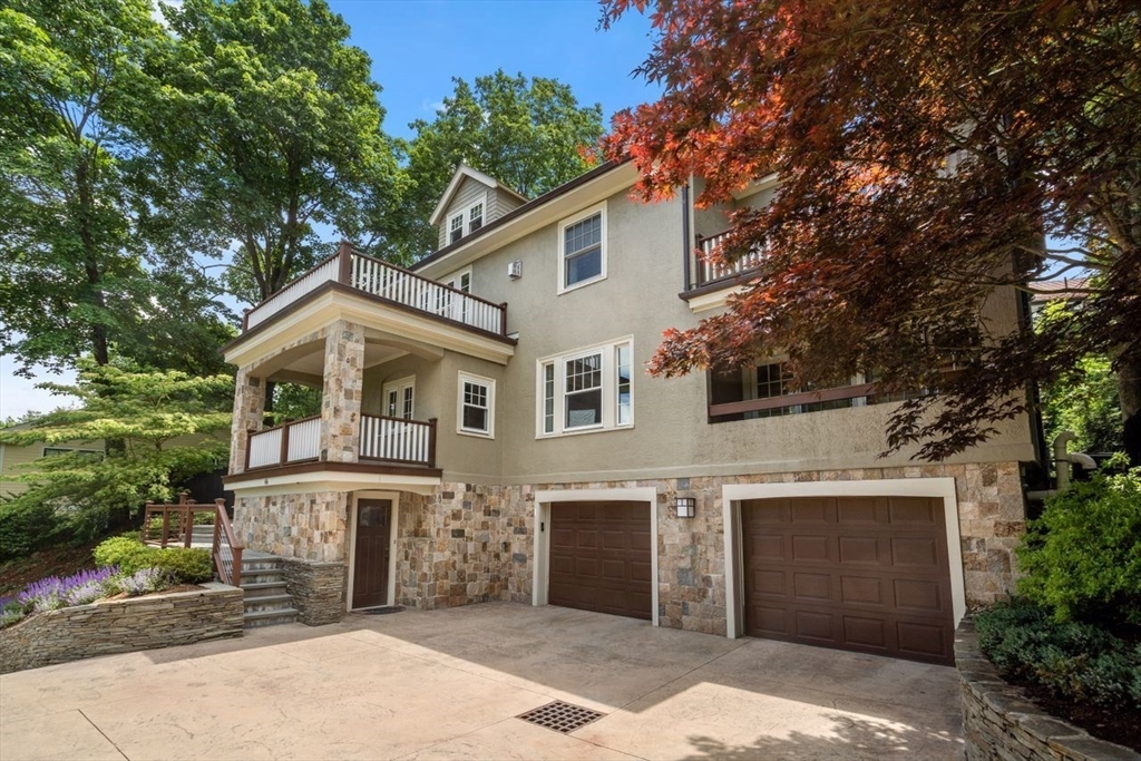 46 Hyslop Road Brookline, MA 02445 - Photo 2 of 33 a front view of a house with a garden