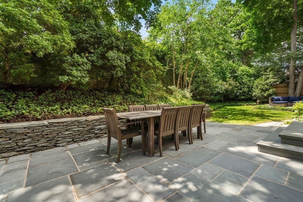 46 Hyslop Road Brookline, MA 02445 - Photo 31 of 33 a view of a dining space with a backyard