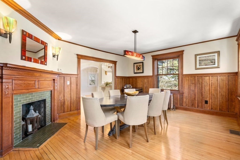 46 Hyslop Road Brookline, MA 02445 - Photo 10 of 33 a view of a dining room with furniture window and wooden floor