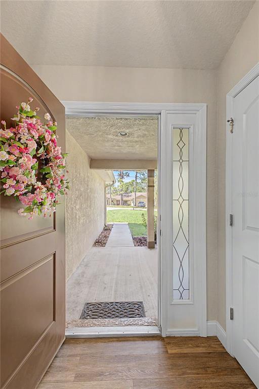 11213 Flock Avenue Weeki Wachee, FL 34613 - Photo 5 of 46 a view of a entryway door