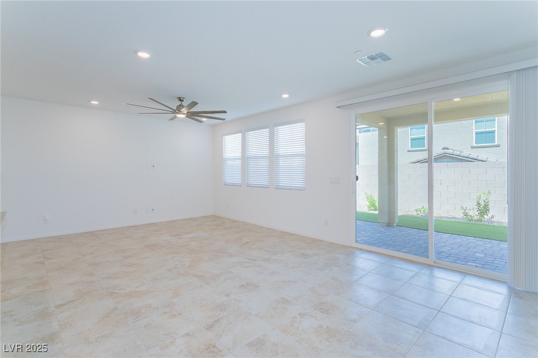3468 Bradano Lane Henderson, NV 89044 - Photo 15 of 50 Empty room with ceiling fan and recessed lighting