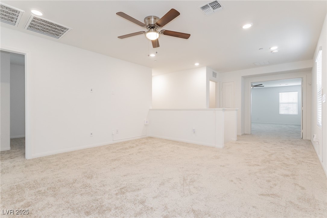 3468 Bradano Lane Henderson, NV 89044 - Photo 17 of 50 Unfurnished room featuring light carpet, a ceiling fan, and recessed lighting