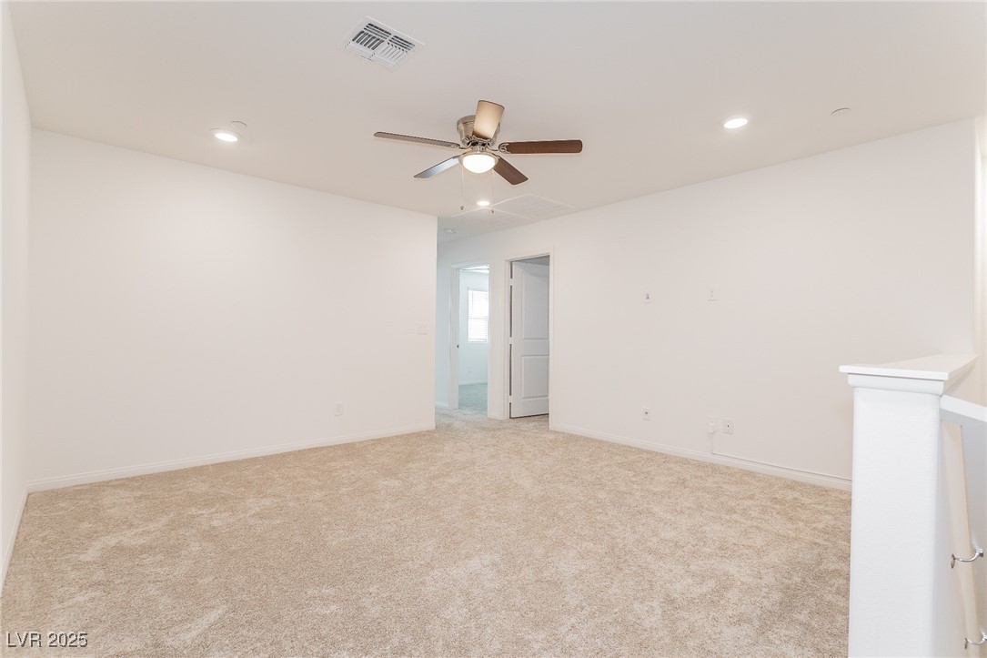 3468 Bradano Lane Henderson, NV 89044 - Photo 18 of 50 Empty room with recessed lighting, light carpet, and ceiling fan