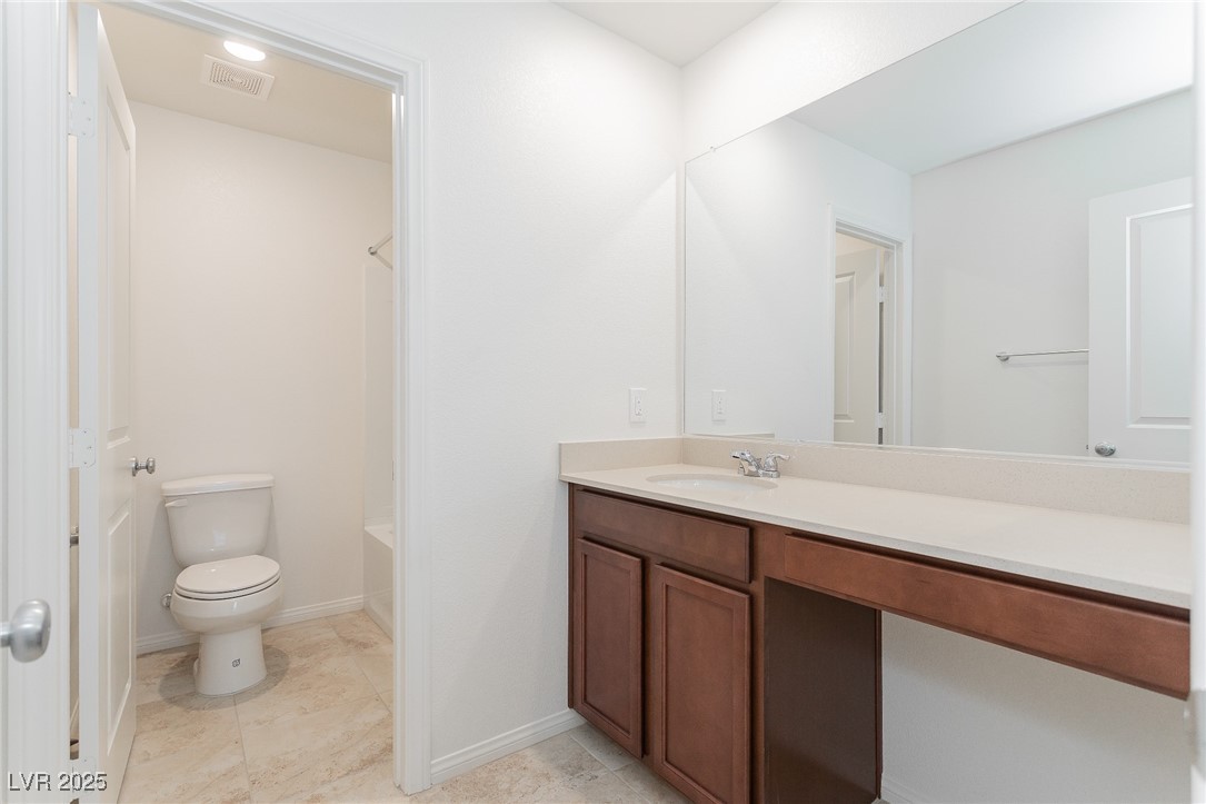 3468 Bradano Lane Henderson, NV 89044 - Photo 21 of 50 Bathroom featuring vanity, light tile patterned floors, and shower / tub combination