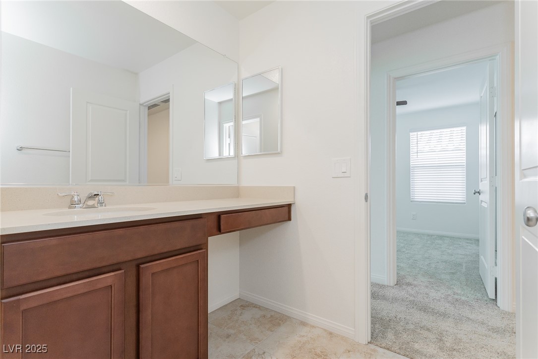 3468 Bradano Lane Henderson, NV 89044 - Photo 22 of 50 Bathroom with vanity and light colored carpet
