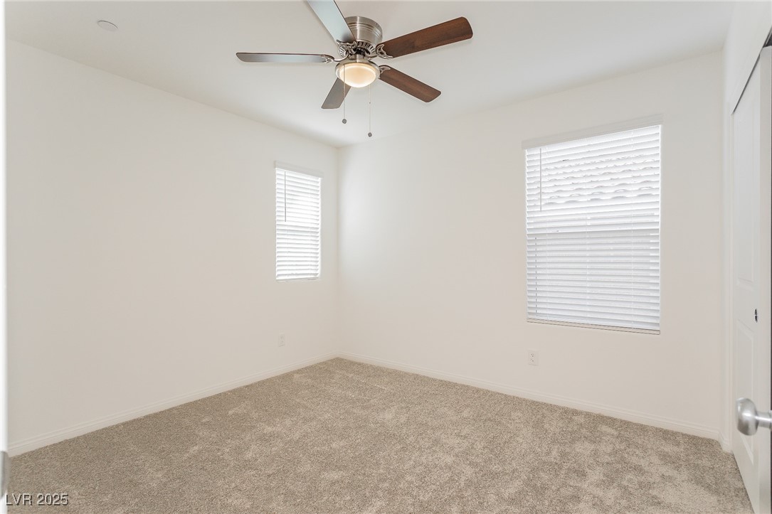 3468 Bradano Lane Henderson, NV 89044 - Photo 23 of 50 Empty room featuring carpet floors and ceiling fan