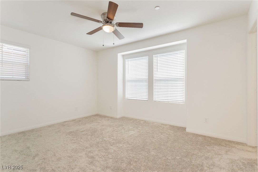 3468 Bradano Lane Henderson, NV 89044 - Photo 25 of 50 Unfurnished room featuring light colored carpet and ceiling fan