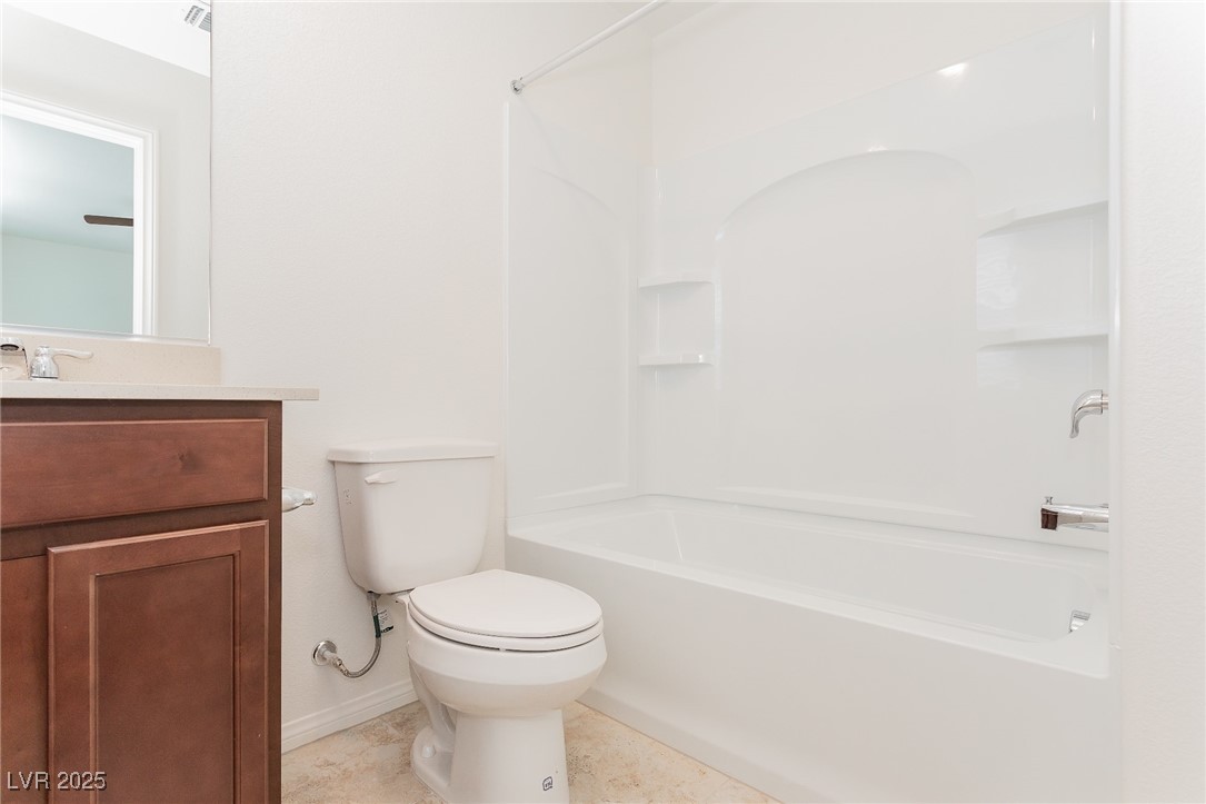 3468 Bradano Lane Henderson, NV 89044 - Photo 29 of 50 Full bath with vanity, shower / tub combination, and light tile patterned floors