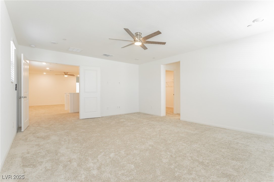 3468 Bradano Lane Henderson, NV 89044 - Photo 34 of 50 Unfurnished room with light carpet and ceiling fan