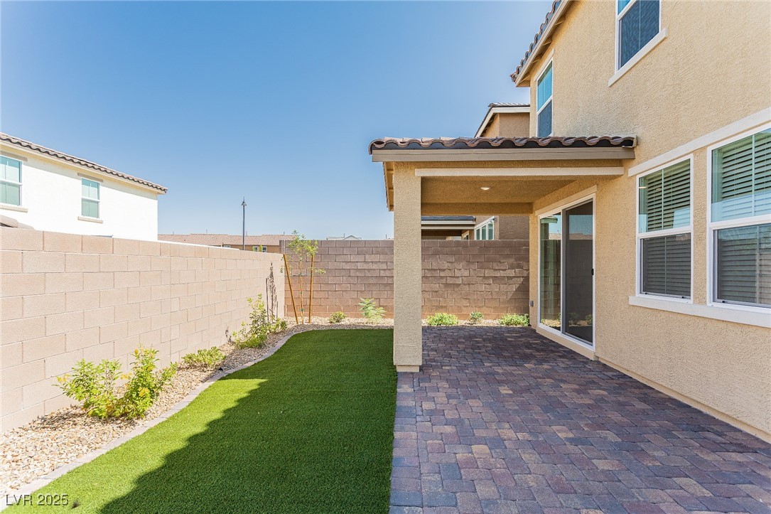 3468 Bradano Lane Henderson, NV 89044 - Photo 40 of 50 Fenced backyard with a patio area