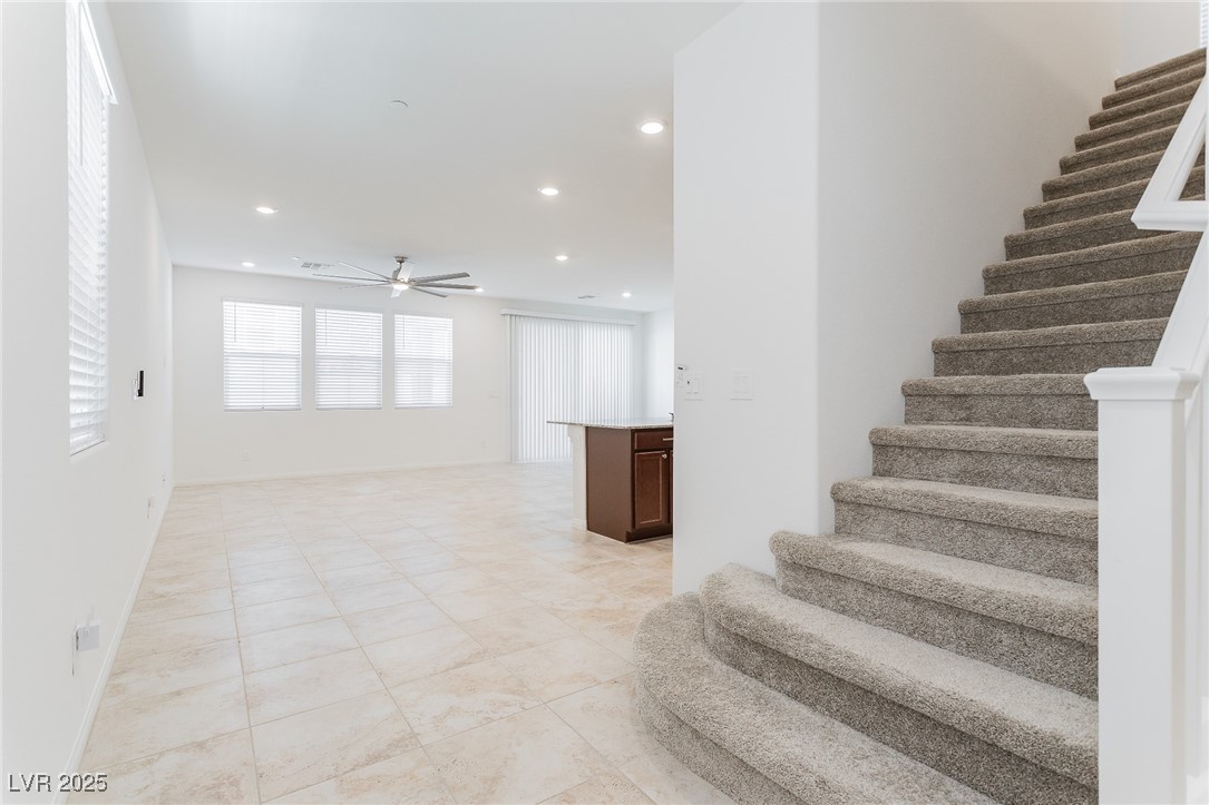 3468 Bradano Lane Henderson, NV 89044 - Photo 8 of 50 Stairway featuring recessed lighting, ceiling fan, and tile patterned flooring
