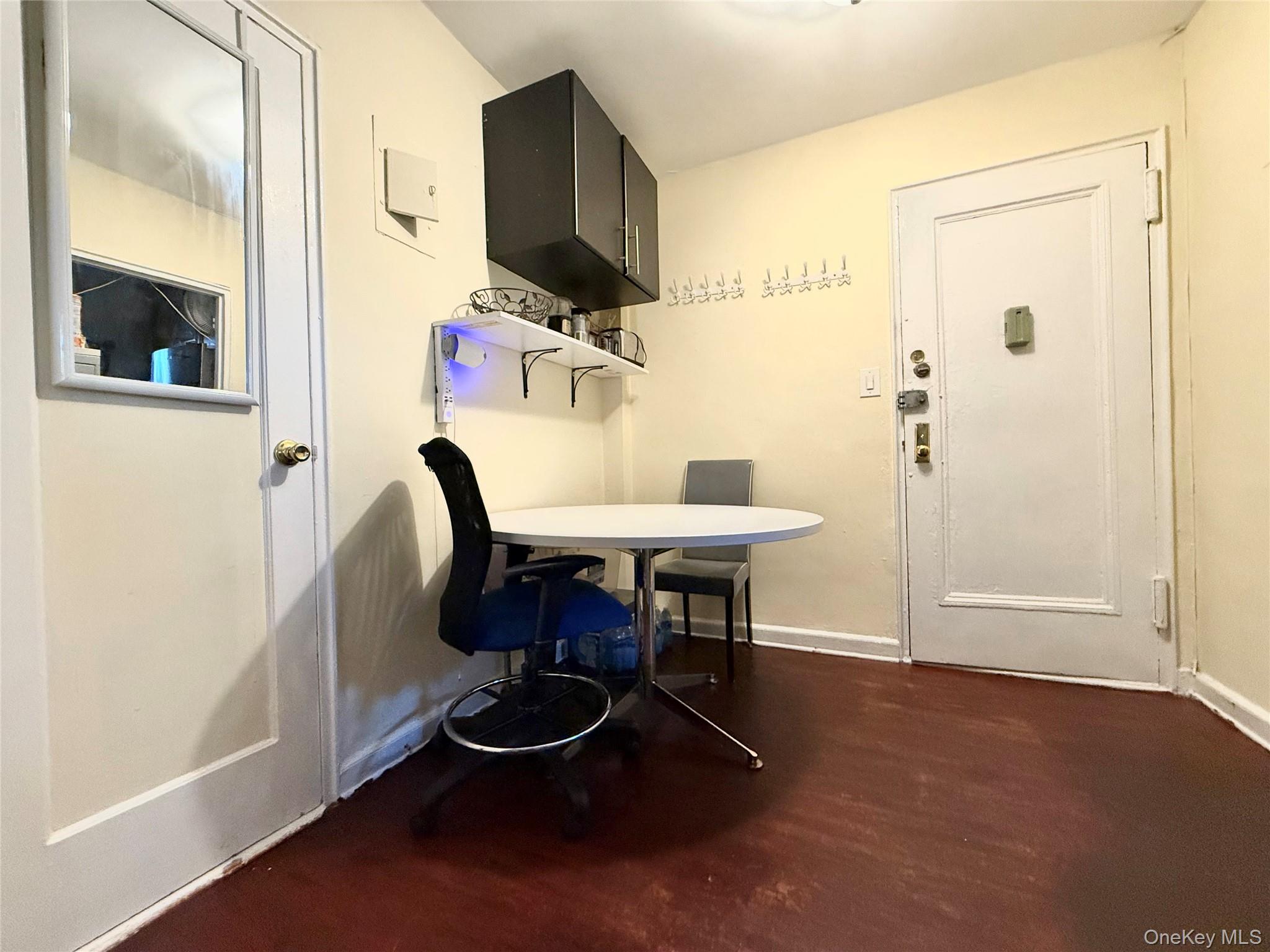 112-25 34th Avenue, Unit 3E Queens, NY 11368 - Photo 12 of 33 a dining room with furniture and a mirror