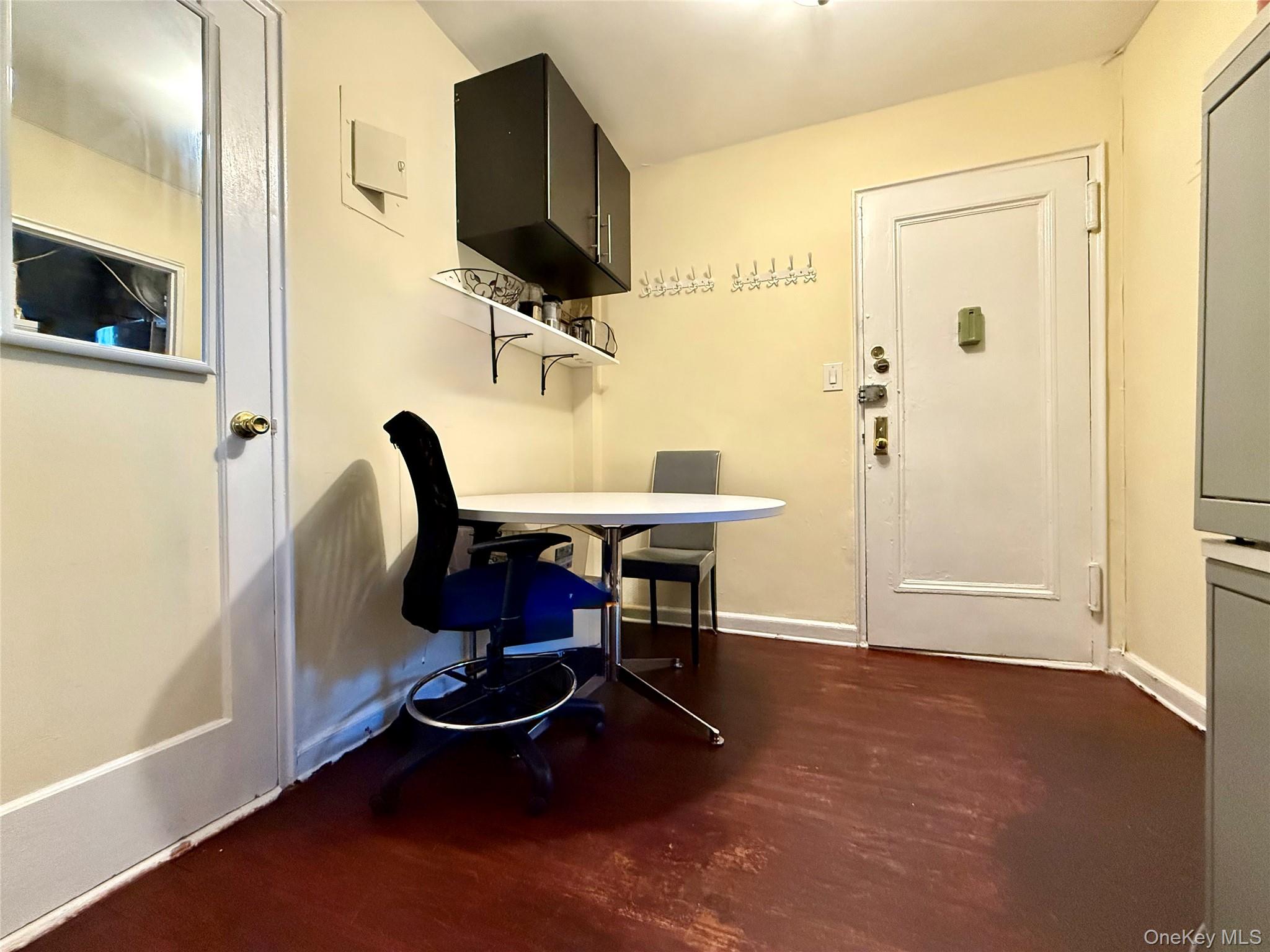 112-25 34th Avenue, Unit 3E Queens, NY 11368 - Photo 13 of 33 a living room with furniture and a flat screen tv