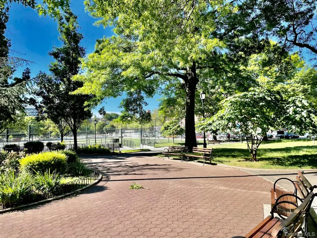 a garden view with a seating space